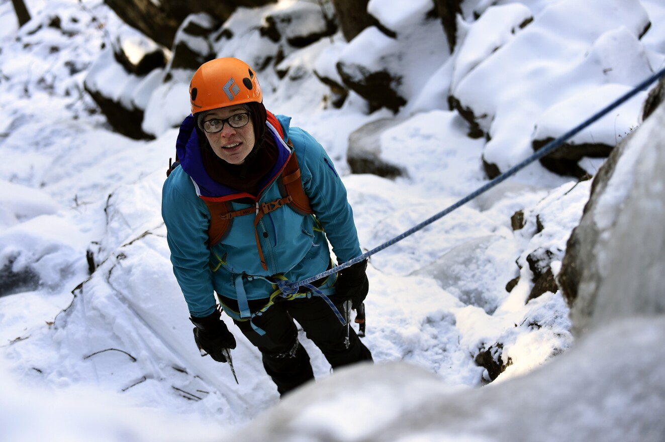Paige Cox is an experienced rock climber, but this is her first time scaling ice. She readies before starting up an ice flow.